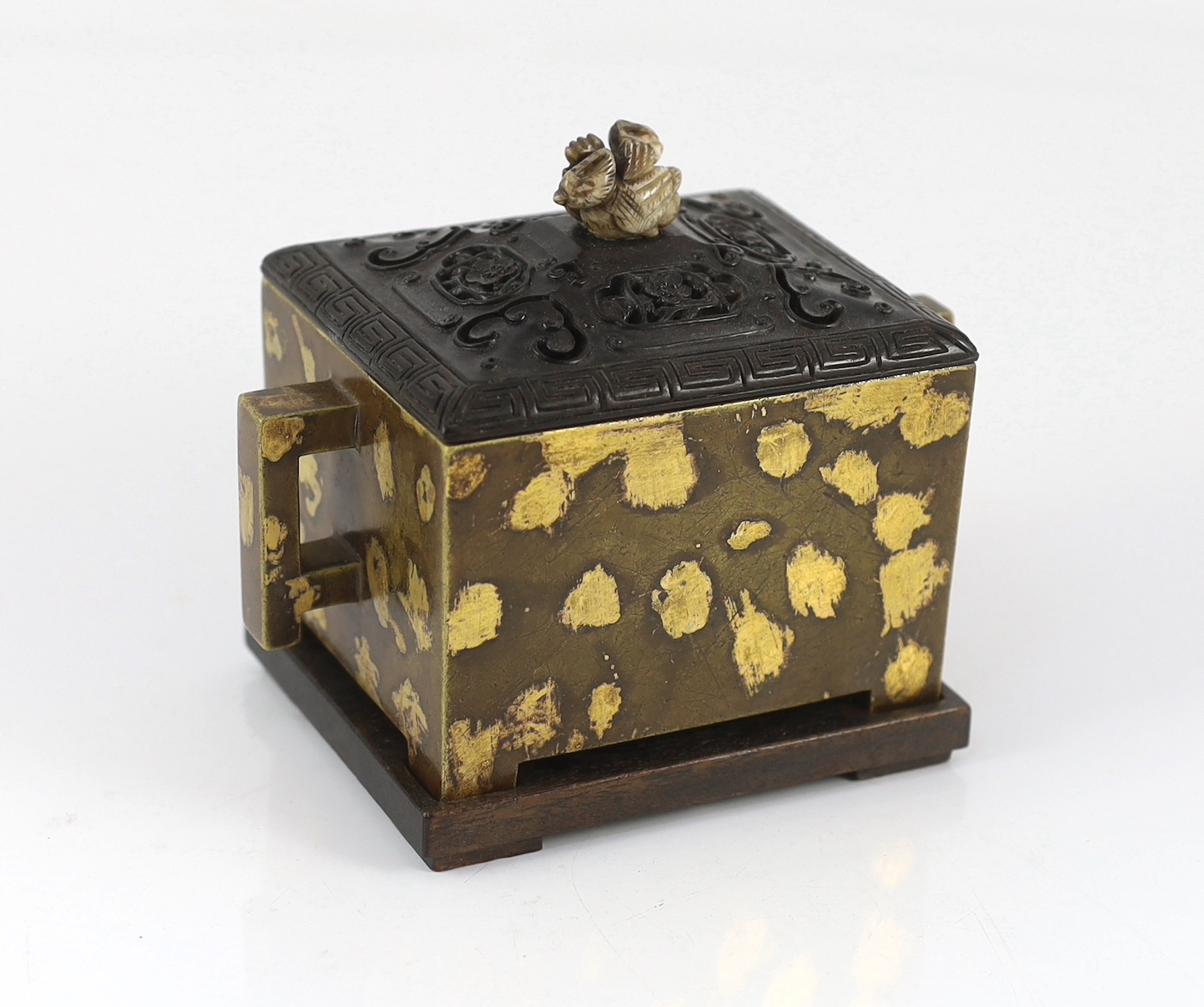 A Chinese gold splashed bronze censer, fangding, wood cover and stand